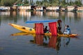 Boat and indian people in Dal lake. Srinagar, India Royalty Free Stock Photo