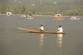 Boat and indian people in Dal lake. Srinagar, Jammu and Kashmir state, India Royalty Free Stock Photo