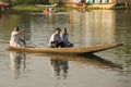 Boat and indian people in Dal lake. Srinagar, Jammu and Kashmir state, India Royalty Free Stock Photo