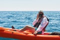 Boat kayaking near cliffs on a sunny day. Travel, sports concept. Lifestyle