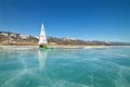 Boat for kitewing frozen ice on a beautiful lake on a background of blue sky Royalty Free Stock Photo