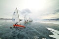 Boat for kitewing frozen ice on a beautiful lake on a background of blue sky Royalty Free Stock Photo