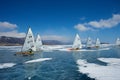 Boat for kitewing frozen ice on a beautiful lake on a background of blue sky Royalty Free Stock Photo