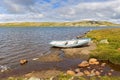 Boat in a lake in Hardangervidda National Park Royalty Free Stock Photo