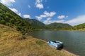 The boat on lake on montains background