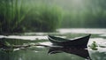 boat on the lake A scary paper boat drifting on a green swamp with fog, .