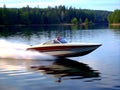 Boat on the lake. Speedboat on the lake in the forest Royalty Free Stock Photo