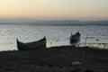 Boat in the lake at sunset. Rowing boat floating over the Limboto Lake waters. Gorontalo, Indonesia