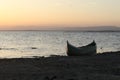 Boat in the lake at sunset. Rowing boat floating over the Limboto Lake waters. Gorontalo, Indonesia