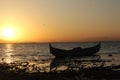 Boat in the lake at sunset. Rowing boat floating over the Limboto Lake waters. Gorontalo, Indonesia