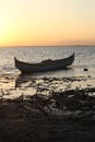 Boat in the lake at sunset. Rowing boat floating over the Limboto Lake waters. Gorontalo, Indonesia