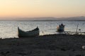 Boat in the lake at sunset. Rowing boat floating over the Limboto Lake waters. Gorontalo, Indonesia