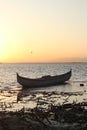 Boat in the lake at sunset. Rowing boat floating over the Limboto Lake waters. Gorontalo, Indonesia