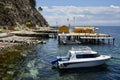 Boat on Lake Titicaca with beach bar behind. Isla del Sol, Bolivia, October 9, 2023. Royalty Free Stock Photo