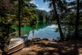 boat on the lake. The Valley of the Five Lakes hike offers clear lakes with unique shades of jade and blue. Clear water