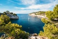 Boat leaves from bay to open sea in Calanques on the azure coast Royalty Free Stock Photo