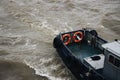 Boat with lifebuoys sailing in the sea