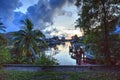 Boat lift in a waterway at sunset in Naples Royalty Free Stock Photo