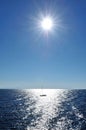 Boat on Lighted Mediterranean Sea, Corse, France Royalty Free Stock Photo