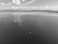 A Boat Load Of Fishers On The Calm Waters Of A Dam