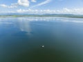 A Boat Load Of Fishers On The Calm Waters Of A Dam