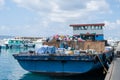 Boat loaded with trash at docks area