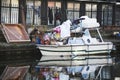 Boat loaded with various junk, standing at Regent canal