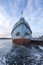 boat locked in ice in a frozen lake Khuvsgul in northern Mongolia
