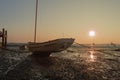 Boat at Low Tide at Sunset