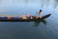 A boat man transport soft drink bottles in his boat