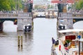 Boat maneuver through the canals of Amsterdam drawbridge