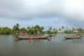 Boat men engage in the sand mining