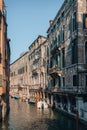 Boat moored on Rio dei Santi Apostoli canal by Ristorante Al Vagon restaurant in Venice, Italy