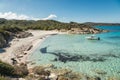 Boat moored in a small cove with sandy beach in Corsica Royalty Free Stock Photo