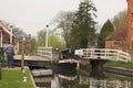 Boat motoring through canal lock Royalty Free Stock Photo