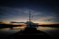 A boat navigates the Javari River after the sunset Royalty Free Stock Photo