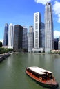 Boat is navigating singapore river Royalty Free Stock Photo