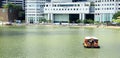 A boat is navigating the singapore river Royalty Free Stock Photo