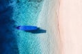 Boat near the beach. Seascape from drone. Blue water background from top view. Gili Meno island, Indonesia. Royalty Free Stock Photo