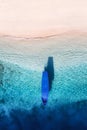 Boat near the beach. Seascape from drone. Blue water background from top view. Gili Meno island, Indonesia. Royalty Free Stock Photo