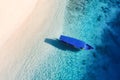 Boat near the beach. Seascape from drone. Blue water background from top view. Gili Meno island, Indonesia. Royalty Free Stock Photo