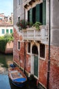 Boat near an old brick house