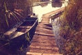 Boat near wooden path on lake Royalty Free Stock Photo