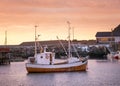 Boat in the Norway bay. Beautiful natural composition during sunrise. Sea and ocean transportation.