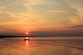 Boat in the ocean at sunrise Royalty Free Stock Photo