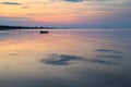 Boat in the ocean at sunrise Royalty Free Stock Photo