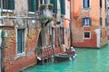 Boat and old brick house in Venice, Italy. Royalty Free Stock Photo