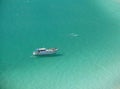 Boat over a crystalline turquoise beach