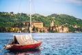Boat over italian lake orta with Orta San Giulio island on the b