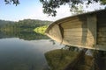 Boat park next to lake with forest at background Royalty Free Stock Photo